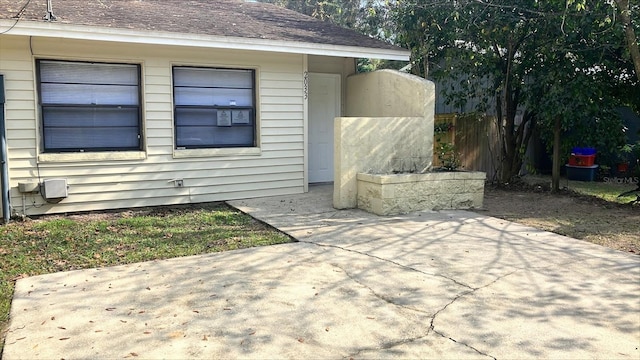 property entrance with a patio