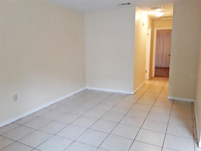 empty room with light tile floors