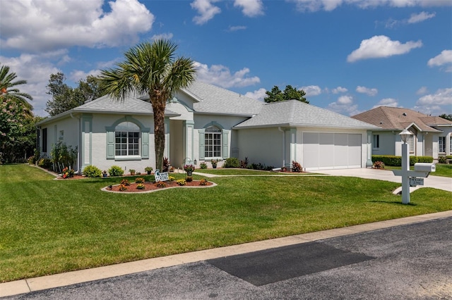 ranch-style home with a front yard and a garage