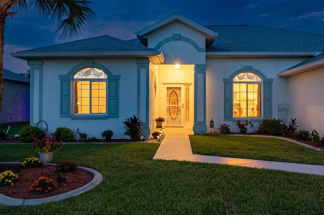 view of front of home featuring a front yard