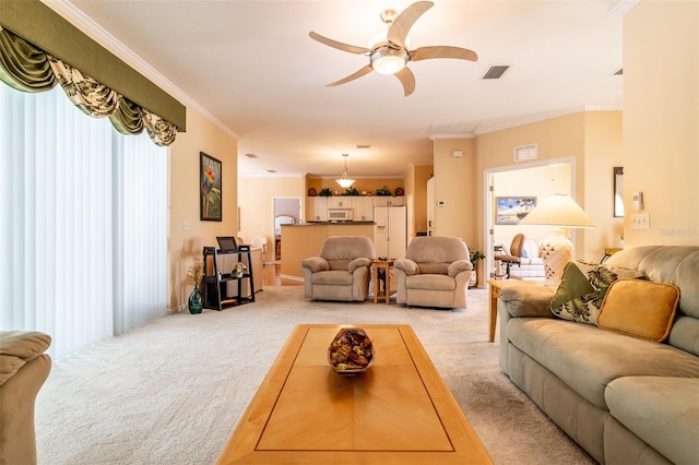 living room with light carpet, ceiling fan, and crown molding