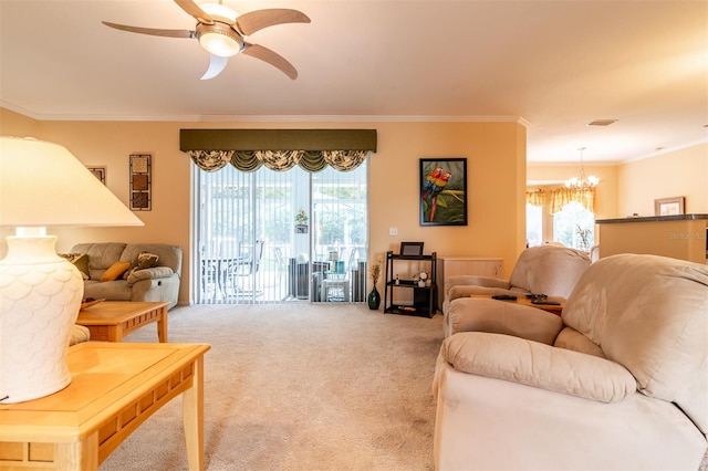 carpeted living room featuring crown molding and ceiling fan with notable chandelier