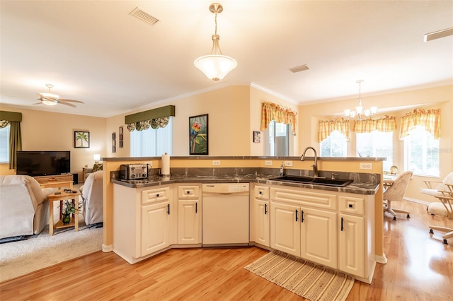 kitchen with hanging light fixtures, ceiling fan with notable chandelier, light wood-type flooring, and dishwasher