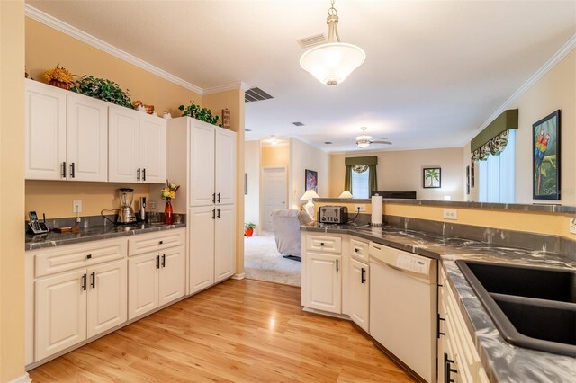 kitchen featuring white dishwasher, pendant lighting, ornamental molding, white cabinetry, and light wood-type flooring