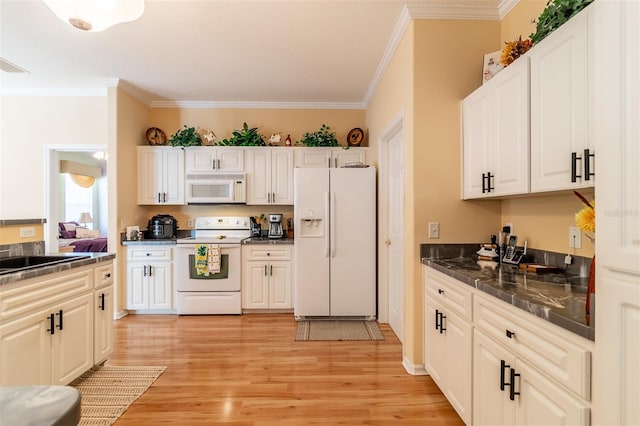 kitchen with ornamental molding, light hardwood / wood-style flooring, white appliances, white cabinetry, and sink