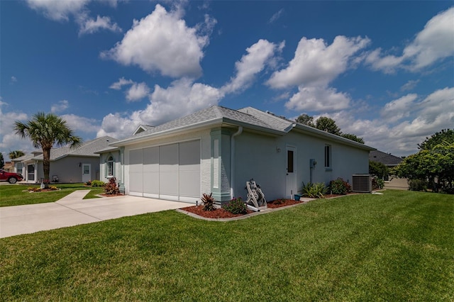 exterior space with central AC and a yard