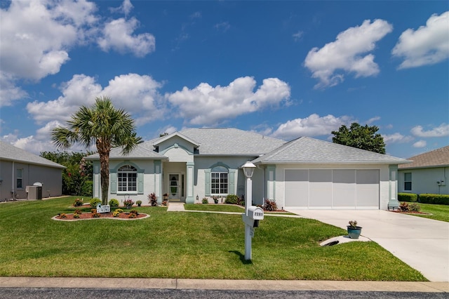 single story home featuring a front lawn, central AC, and a garage