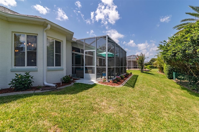 view of yard featuring glass enclosure