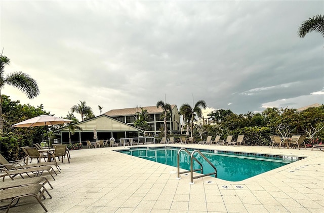 view of swimming pool with a patio area