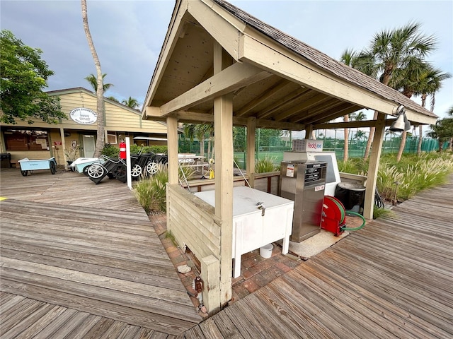 view of dock with a gazebo and a deck