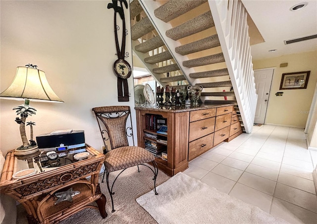 sitting room featuring light tile patterned floors