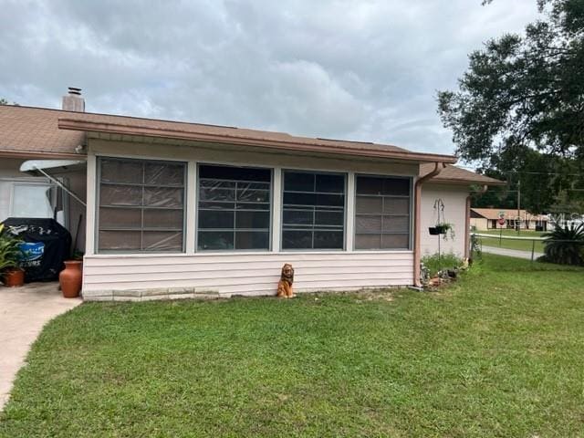 exterior space with a front lawn