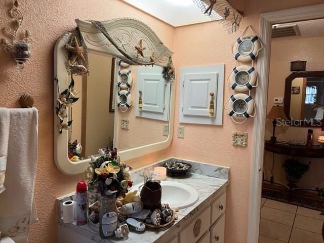 bathroom featuring vanity and tile flooring