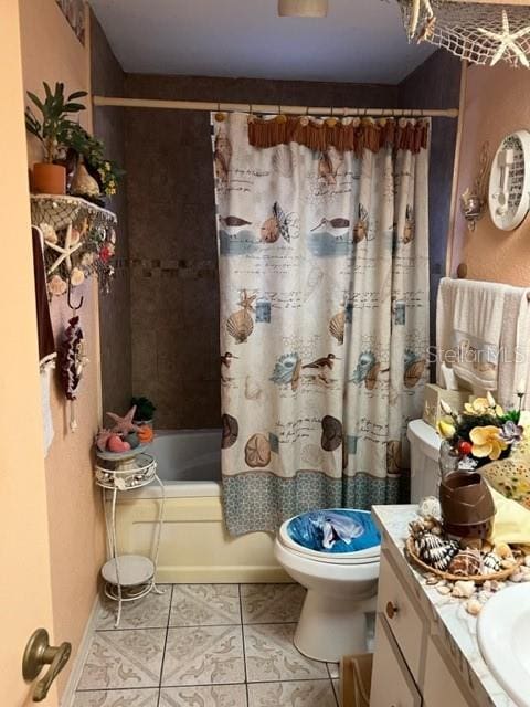 full bathroom featuring vanity, tile flooring, toilet, and shower / bathtub combination with curtain