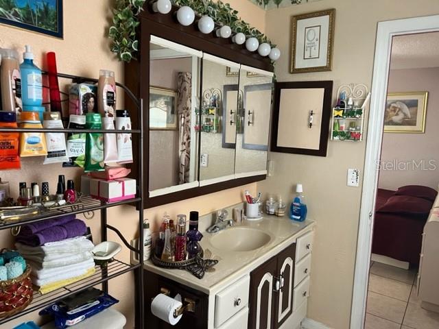 bathroom featuring vanity and tile flooring