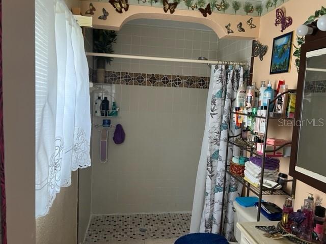 bathroom featuring walk in shower