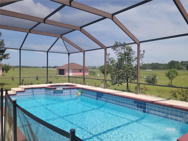 view of swimming pool with an in ground hot tub, a lanai, a lawn, and pool water feature