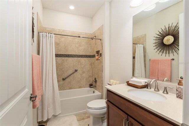 full bathroom featuring toilet, shower / tub combo with curtain, oversized vanity, and tile flooring