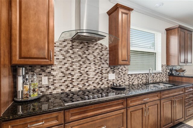 kitchen featuring backsplash, range hood, sink, dark stone countertops, and ornamental molding