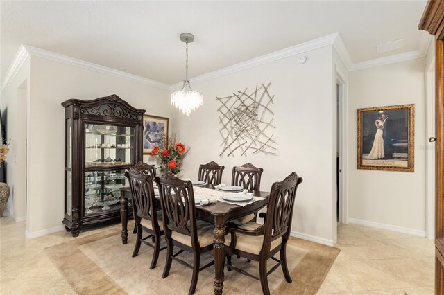 dining area with a chandelier, light tile floors, and crown molding