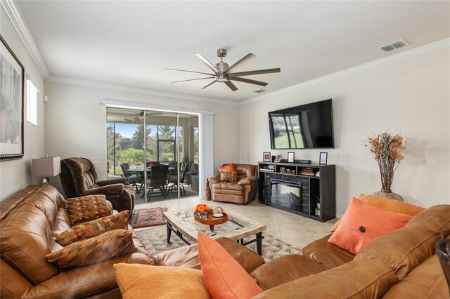 tiled living room with crown molding and ceiling fan