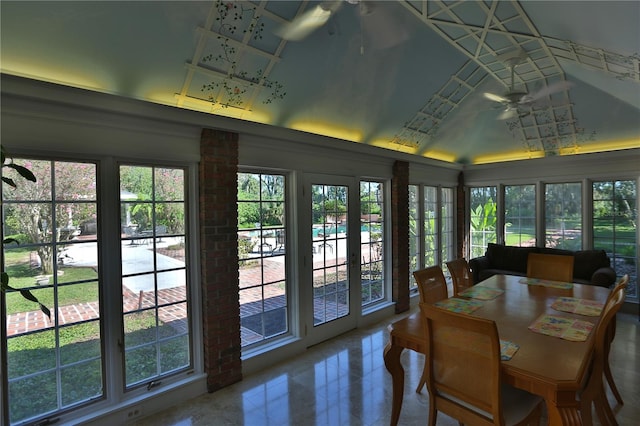 sunroom with ceiling fan and a healthy amount of sunlight