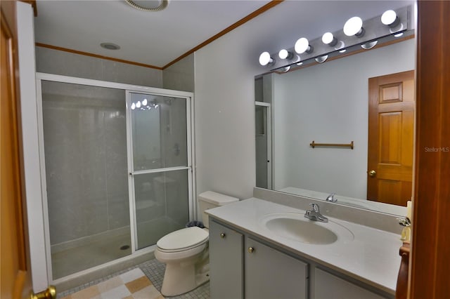 bathroom featuring an enclosed shower, tile floors, vanity with extensive cabinet space, toilet, and ornamental molding