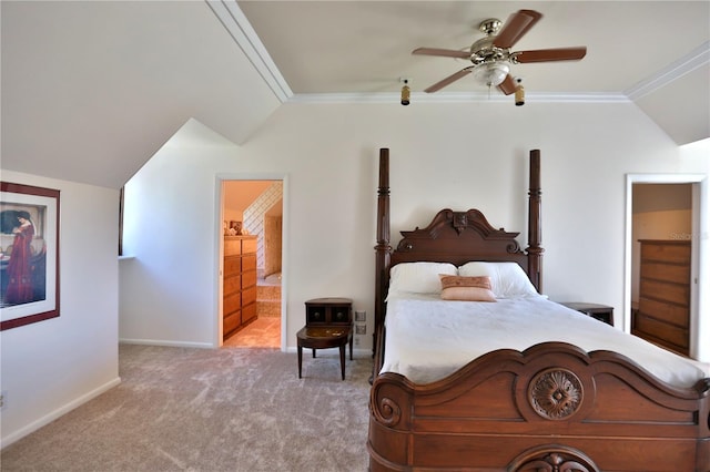 carpeted bedroom featuring connected bathroom, lofted ceiling, crown molding, and ceiling fan