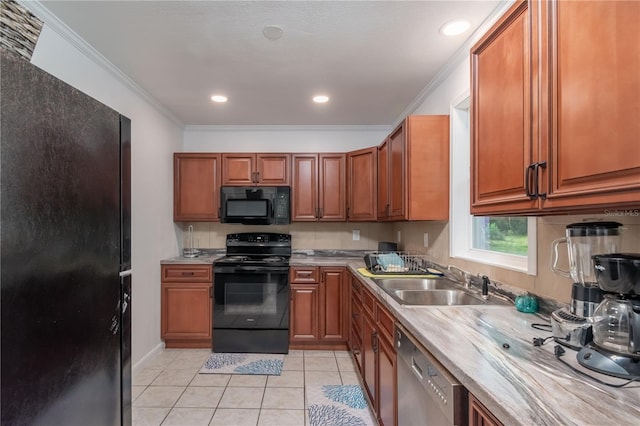 kitchen featuring light tile flooring, ornamental molding, black appliances, and sink