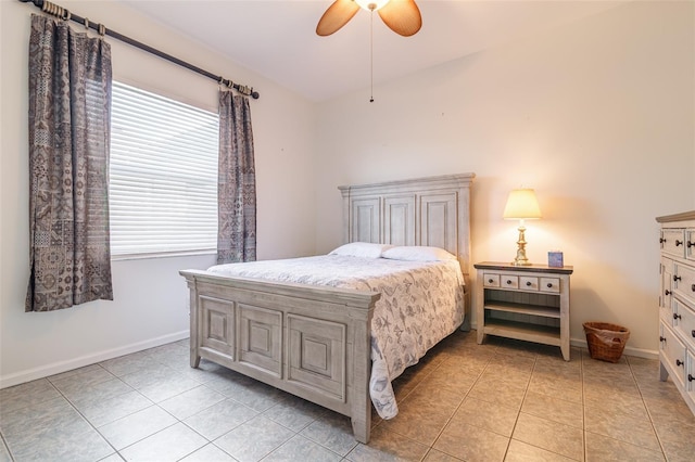 bedroom with light tile floors and ceiling fan