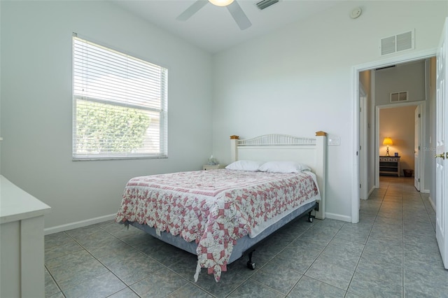 bedroom featuring light tile floors and ceiling fan