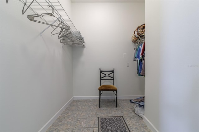 spacious closet featuring light tile flooring