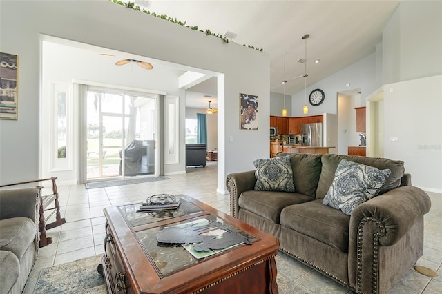 tiled living room with high vaulted ceiling