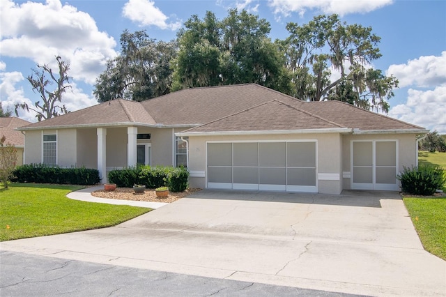 ranch-style house with a front yard and a garage