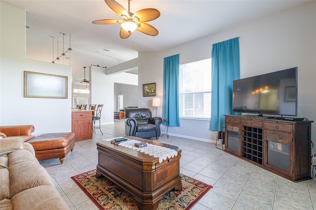 living room with light tile flooring and ceiling fan