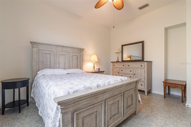 tiled bedroom with ceiling fan