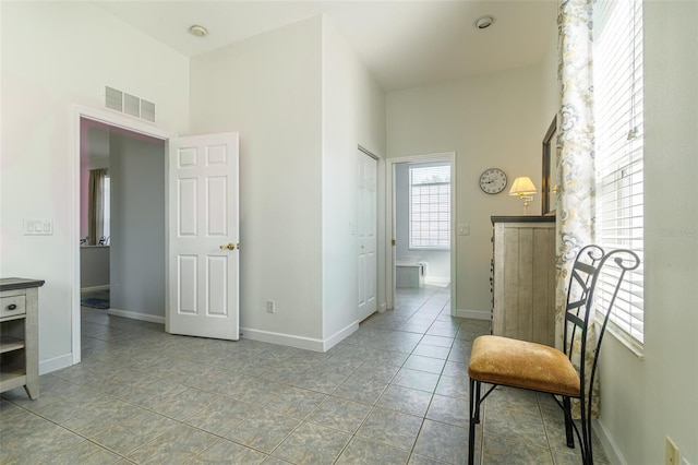 sitting room featuring light tile flooring