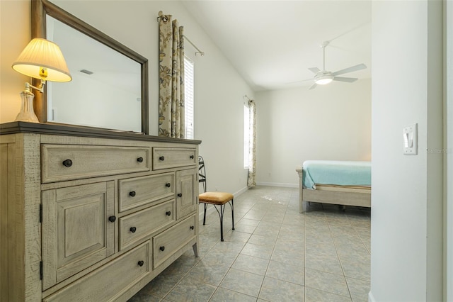 tiled bedroom featuring lofted ceiling