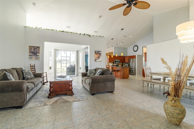 living room featuring tile flooring, ceiling fan, and high vaulted ceiling