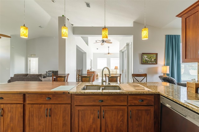 kitchen featuring ceiling fan, sink, stainless steel dishwasher, decorative light fixtures, and lofted ceiling