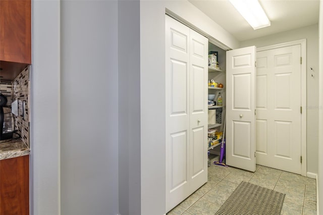 hallway with light tile flooring