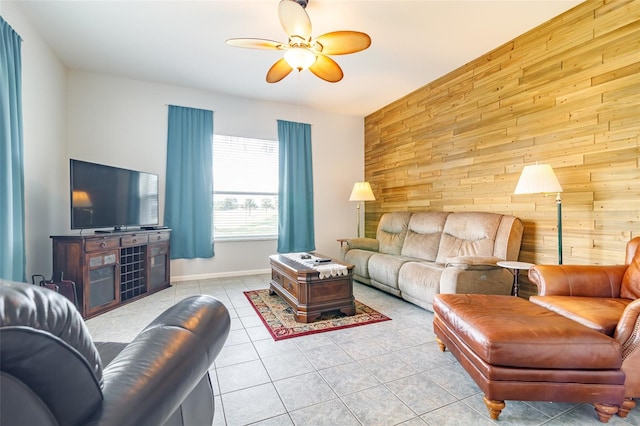 tiled living room with wooden walls and ceiling fan