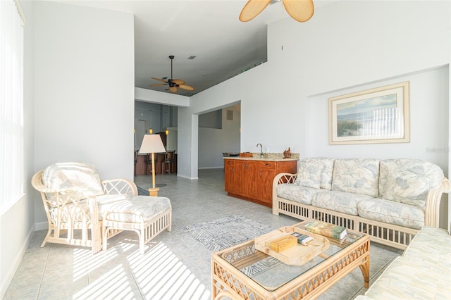 living room featuring ceiling fan and light tile flooring