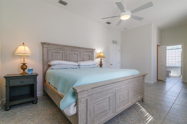 tiled bedroom featuring ceiling fan