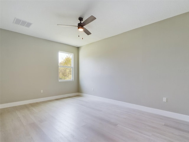 unfurnished room with light hardwood / wood-style flooring and ceiling fan