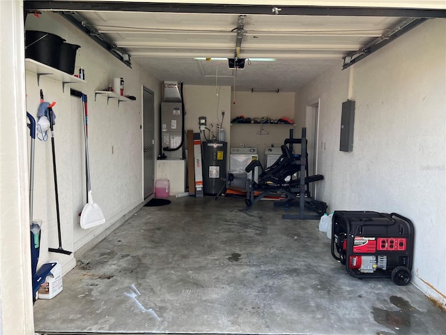 garage featuring a garage door opener, water heater, washing machine and clothes dryer, and heating utilities