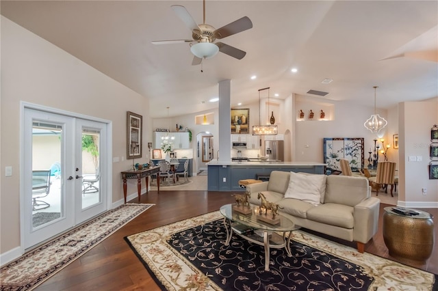 living room featuring french doors, dark hardwood / wood-style flooring, vaulted ceiling, and ceiling fan