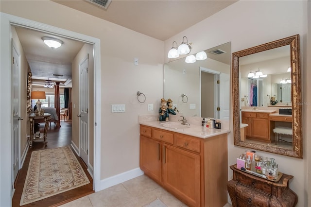 bathroom with hardwood / wood-style floors and vanity