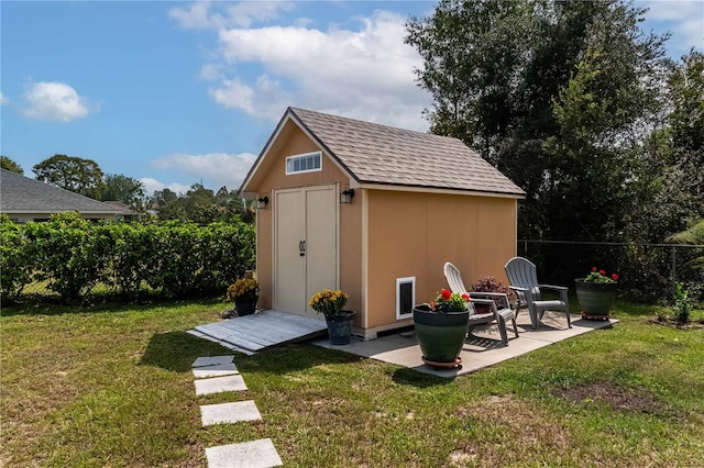 view of outbuilding with a lawn