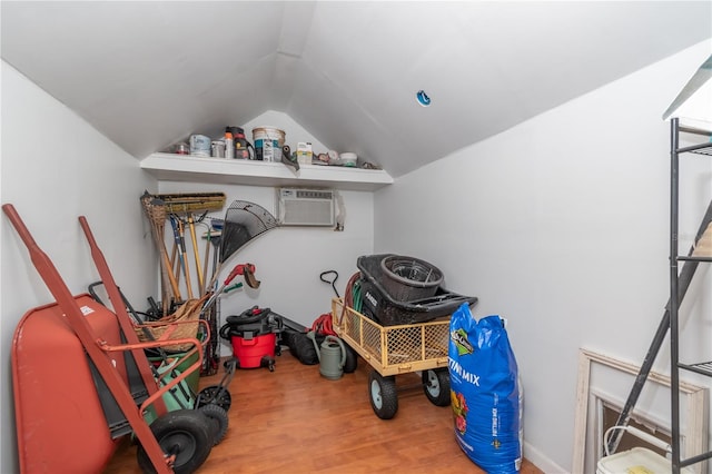 storage room featuring an AC wall unit